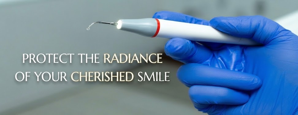 Dental care banner with a gloved hand holding an ultrasonic dental scaler and the tagline 'Protect the radiance of your cherished smile'